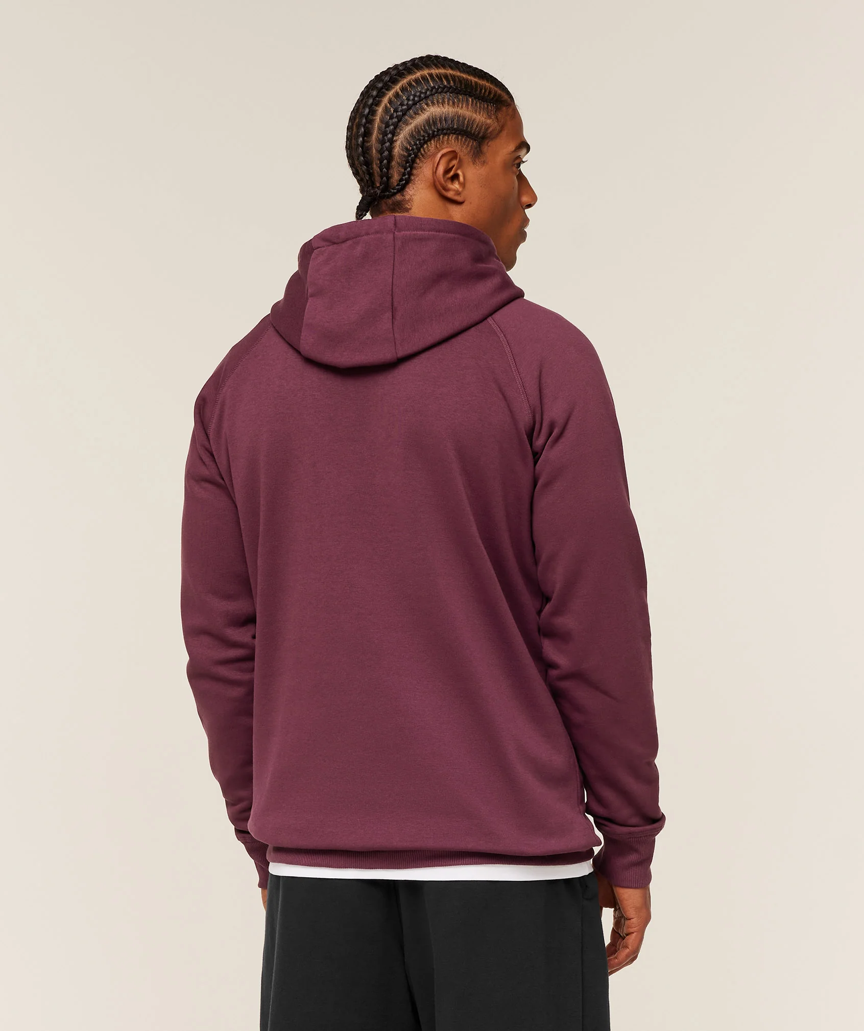 Person wearing a burgundy hoodie.
