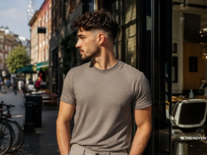 A stylish man with taper fade outside a modern barbershop showing low fade vs taper fade difference