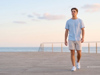 Stylish man wearing sneakers for men on a beach side